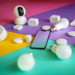 Smart devices arranged on colorful background showcasing modern technology options.